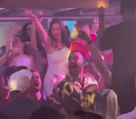Travis Kelce downs champagne while surrounded by women at Vegas club after leaving Taylor Swift in Australia